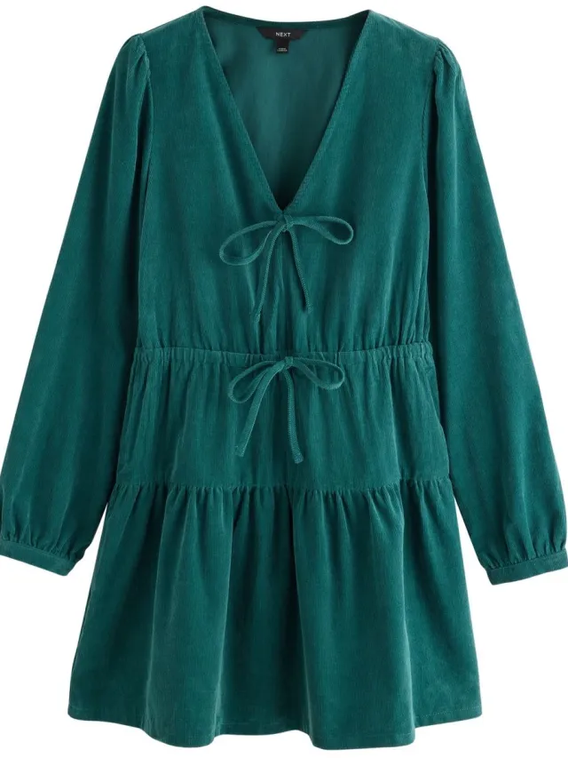 Next Dames - Petite corduroy mini-jurk met V-hals, strik en lange mouwen - Petite - Blauw Teal Blue